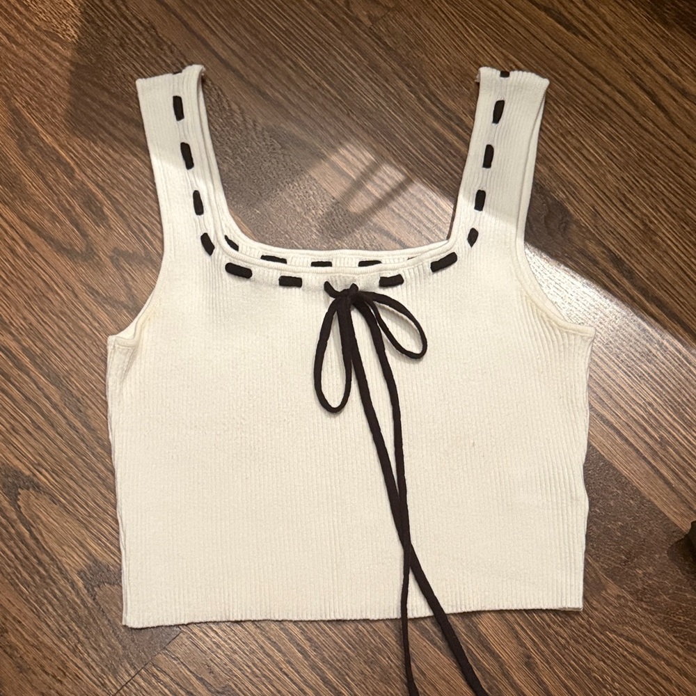 Elegant Cream Tank Top with Black Detailing